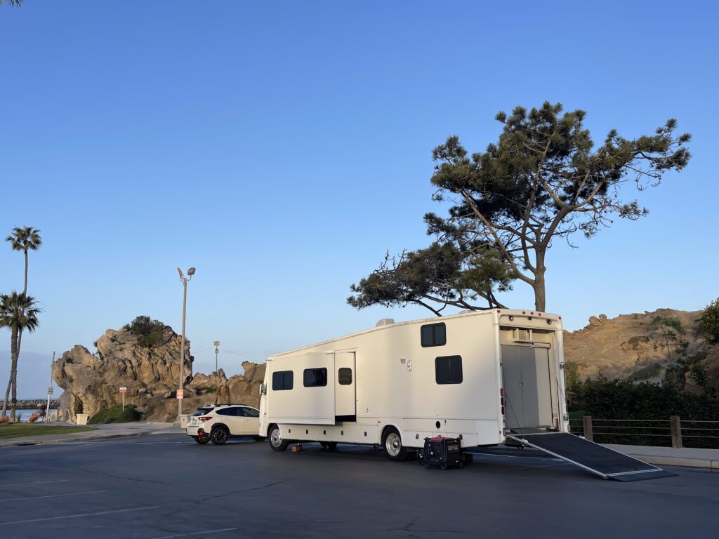 WH1 production motorhome parked at scenic Corona Del Mar location